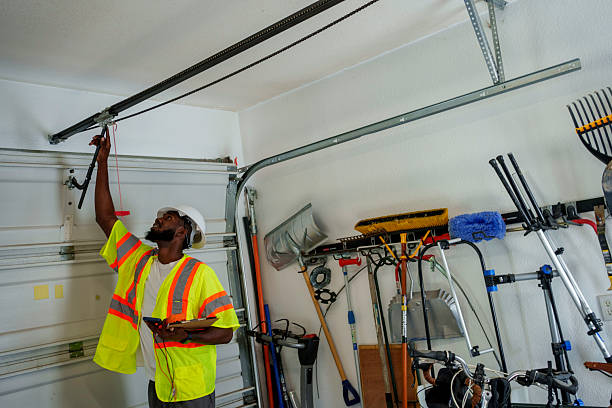Professional Garage Door Installation technician working in Iola, KS